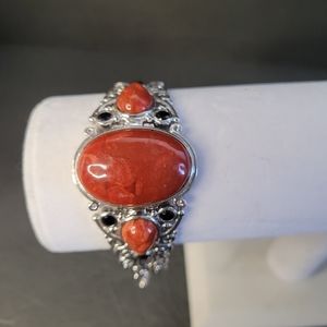 Beautiful 925 silver bracelet with 3 orange stones and 6 small black stones